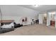 Large bonus room with carpet, and neutral paint with a partial view of an attached bathroom at 71 Smithsanders Ct, Smithfield, NC 27577
