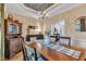 Dining room with wood floors, chandelier, china cabinet and dining table with seating at 71 Smithsanders Ct, Smithfield, NC 27577