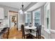 Cozy dining room with a round table, upholstered chairs, and natural light from bay windows at 71 Smithsanders Ct, Smithfield, NC 27577