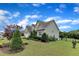 Lovely yard and a long driveway connect to an attached two-car garage at 71 Smithsanders Ct, Smithfield, NC 27577