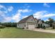 A well-maintained yard and a long driveway connect to an attached two-car garage at 71 Smithsanders Ct, Smithfield, NC 27577