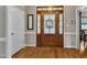 Welcoming foyer with hardwood floors, a wooden door, and a glimpse into adjacent rooms at 71 Smithsanders Ct, Smithfield, NC 27577