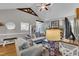 Spacious living room with vaulted ceilings, exposed beams, modern furnishings, and hardwood floors at 71 Smithsanders Ct, Smithfield, NC 27577