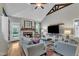 Bright living room boasts a fireplace, vaulted ceilings with beams, and comfortable seating at 71 Smithsanders Ct, Smithfield, NC 27577