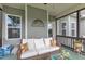 Relaxing screened porch with comfortable seating, decorative pillows and green vinyl siding at 71 Smithsanders Ct, Smithfield, NC 27577