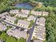 A beautiful aerial view of the community showcasing lush trees and a tranquil lake at 8004 Thrush Ridge Ln, Raleigh, NC 27615