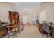 Neutral bedroom features antique desk and hutch as well as white walls and a large doorway at 8004 Thrush Ridge Ln, Raleigh, NC 27615