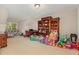 Spacious bedroom with neutral tones, large bookcase, and ample play area for  at 8004 Thrush Ridge Ln, Raleigh, NC 27615