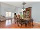 Elegant dining room with hardwood floors, a large china cabinet, and a spacious table for gatherings at 8004 Thrush Ridge Ln, Raleigh, NC 27615