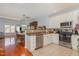 Bright kitchen with stainless steel appliances, light cabinets, and an open view to dining area at 8004 Thrush Ridge Ln, Raleigh, NC 27615
