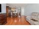 Spacious living room boasting hardwood floors and a comfortable recliner, perfect for relaxation at 8004 Thrush Ridge Ln, Raleigh, NC 27615