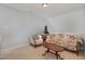 Cozy living room featuring a floral sofa, side chair, and a small decorative Christmas tree at 8004 Thrush Ridge Ln, Raleigh, NC 27615