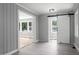 Charming bedroom featuring wood-look floors, gray walls, and a sliding barn door at 813 Burton St, Rocky Mount, NC 27803