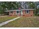 Beautiful brick home with a well-maintained lawn and inviting front entrance steps at 813 Burton St, Rocky Mount, NC 27803