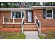 Inviting entrance with classic brick steps and decorative railing at 813 Burton St, Rocky Mount, NC 27803