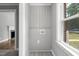 Cozy laundry area with gray wood-look floors and a bright window at 813 Burton St, Rocky Mount, NC 27803