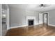Spacious living room featuring hardwood floors and a classic fireplace at 813 Burton St, Rocky Mount, NC 27803