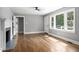 Bright living room with hardwood floors, fireplace, and lots of natural light at 813 Burton St, Rocky Mount, NC 27803