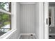 Mud room area with gray walls, wood-look floors, and outdoor access at 813 Burton St, Rocky Mount, NC 27803
