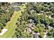 Expansive aerial view showcasing the home nestled near a golf course and lake at 84307 Winslow, Chapel Hill, NC 27517