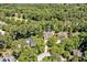 Aerial view showcasing the property nestled within a lush, green forest at 84307 Winslow, Chapel Hill, NC 27517