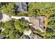 Aerial view of home showcasing well-manicured landscaping and circular driveway at 84307 Winslow, Chapel Hill, NC 27517
