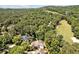 Aerial view of home situated on a tree-lined lot close to the golf course at 84307 Winslow, Chapel Hill, NC 27517