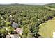 Aerial view of home situated on a tree-lined lot close to the golf course at 84307 Winslow, Chapel Hill, NC 27517
