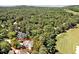 Aerial view of home situated on a tree-lined lot close to the golf course at 84307 Winslow, Chapel Hill, NC 27517