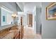 Bright bathroom with granite countertop, tile flooring, and walk-in shower, offering a spa-like experience at 84307 Winslow, Chapel Hill, NC 27517