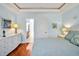 Cozy bedroom featuring light blue walls, hardwood floors, and a well-appointed dresser, creating a relaxing ambiance at 84307 Winslow, Chapel Hill, NC 27517