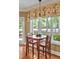 Cozy breakfast nook with a view of the backyard and natural light at 84307 Winslow, Chapel Hill, NC 27517