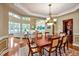Elegant dining room with tray ceiling, chandelier, and access to the living room, perfect for entertaining at 84307 Winslow, Chapel Hill, NC 27517