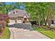 Beautiful brick home with mature landscaping and a curved driveway at 84307 Winslow, Chapel Hill, NC 27517