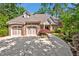 Charming brick home with a well-manicured front yard and a three car garage at 84307 Winslow, Chapel Hill, NC 27517