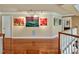 Second floor hallway with hardwood floors and decorative paintings on display at 84307 Winslow, Chapel Hill, NC 27517