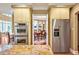 Contemporary kitchen featuring built-in oven, stainless refrigerator, and granite countertops at 84307 Winslow, Chapel Hill, NC 27517