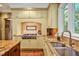 Gourmet kitchen showcasing granite countertops, stainless steel appliances, and custom tile backsplash at 84307 Winslow, Chapel Hill, NC 27517
