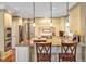 Modern kitchen with stainless steel appliances, granite counters, and an open layout at 84307 Winslow, Chapel Hill, NC 27517