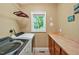 Functional laundry room with updated washer, dryer and ample counter space at 84307 Winslow, Chapel Hill, NC 27517
