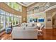 Spacious living room with hardwood floors, large windows, and comfortable seating arrangement at 84307 Winslow, Chapel Hill, NC 27517