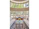 Beautiful living room with a wall of windows offering scenic views, elegant furnishings and decor at 84307 Winslow, Chapel Hill, NC 27517