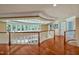 Open loft area with hardwood floors, decorative railings and natural light at 84307 Winslow, Chapel Hill, NC 27517