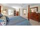 A spacious main bedroom features a ceiling fan and a large window at 84307 Winslow, Chapel Hill, NC 27517
