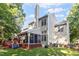 This home features a large back yard with a screened in porch, a deck, and a tall chimney at 9504 Anson Grove Lane Ln, Raleigh, NC 27615