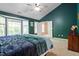 Bedroom with a high ceiling, dark green walls, ceiling fan, and bay windows at 9504 Anson Grove Lane Ln, Raleigh, NC 27615