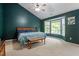 Bedroom with a high ceiling, dark green walls, ceiling fan, and bay windows at 9504 Anson Grove Lane Ln, Raleigh, NC 27615