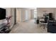 Spacious bedroom featuring a work area, neutral carpet, and two closets at 9504 Anson Grove Lane Ln, Raleigh, NC 27615