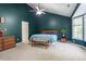 Bedroom with a high ceiling, dark green walls, ceiling fan, and bay windows at 9504 Anson Grove Lane Ln, Raleigh, NC 27615
