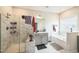 Spacious primary bathroom featuring double vanity, soaking tub, walk-in shower and marble tile at 1051 Jura Ridge Dr, Fuquay Varina, NC 27526